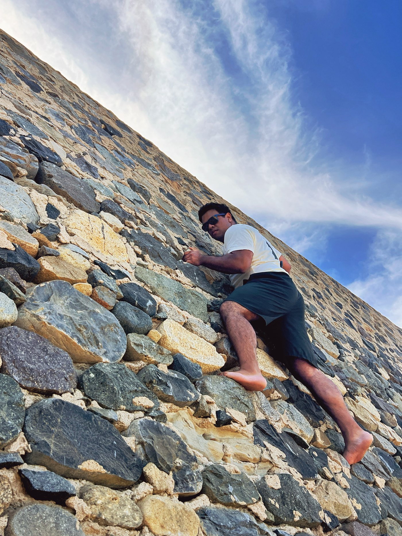 Jason climbing outdoors on a rock face